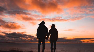 A husband and wife holding hands