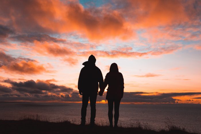 A husband and wife holding hands